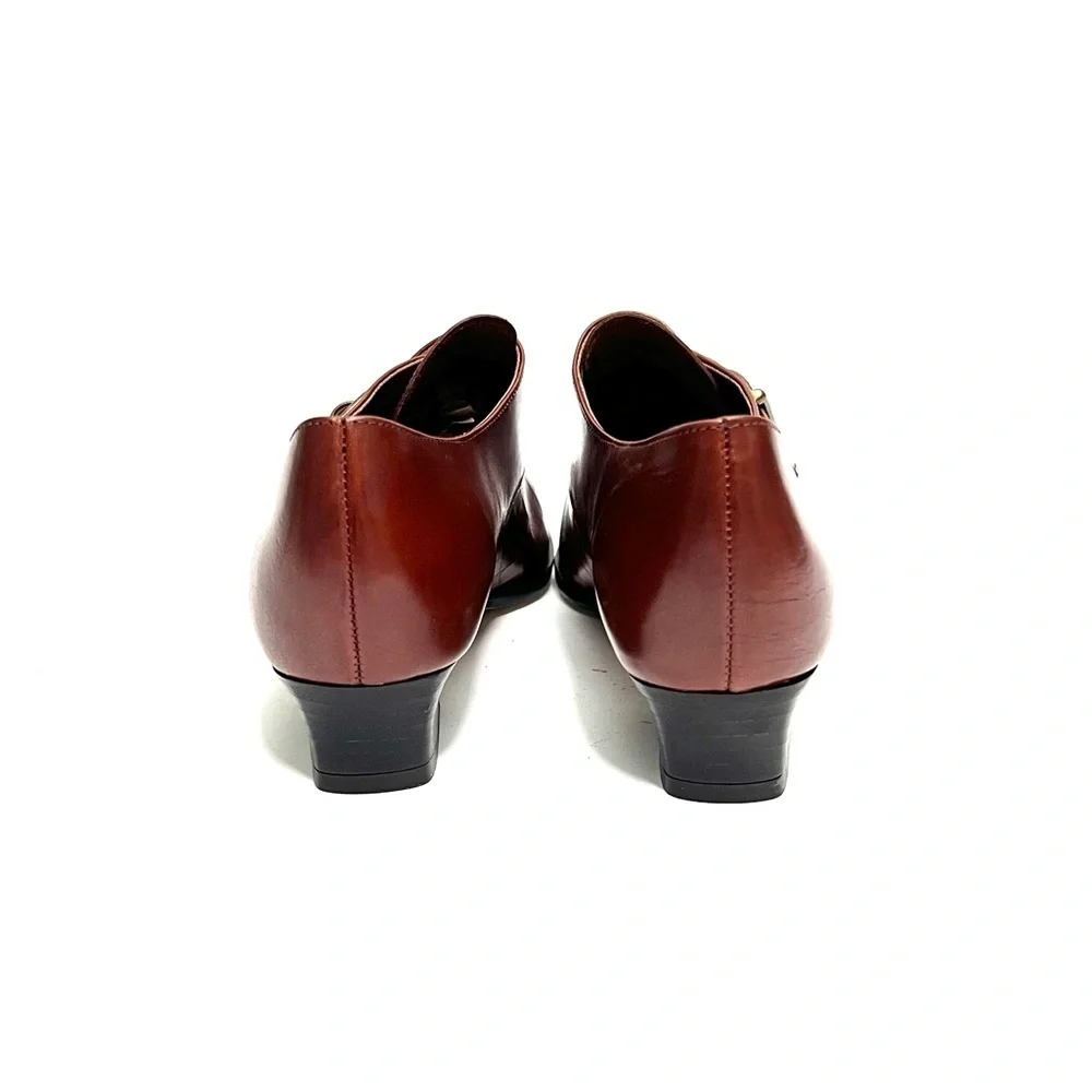 Vintage 1980s deadstock women's brown leather heeled buckle loafers